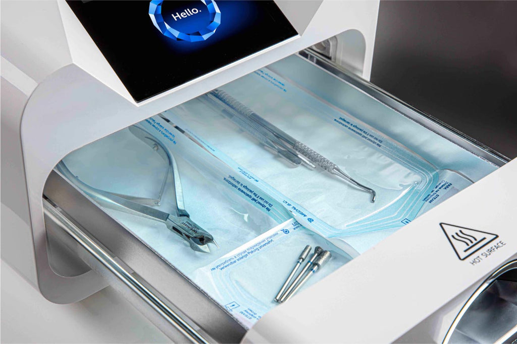 Product shot of a sterilizer with dental tools inside. 